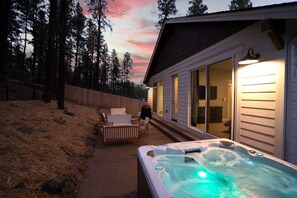 Enjoy a sunset soak in the fenced back yard.