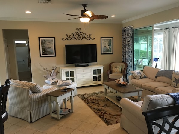 Living room with 60" flat screen television.