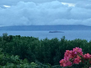 Storm clouds over the island of Kahoolawe  & Molokini craterfrom the pool area. 