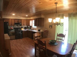 Cedar Breeze has a fully equipped kitchen with cozy dining area.