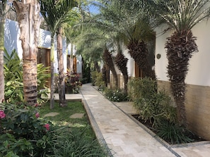 Opposite view of main hallway of home with rooms to the sides. 