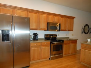 Kitchen has stainless steel appliances