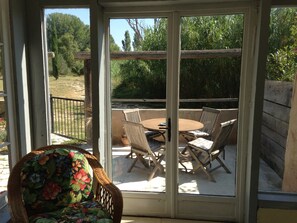 view to outside dining area from conservatory