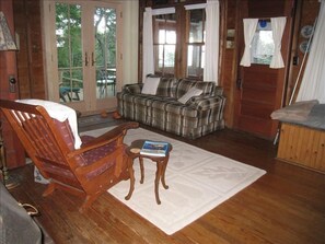 Living room with french door opening onto deck