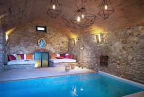 The heated indoor pool with lounge area