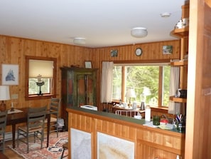 Looking over 1/2 wall into kitchen area