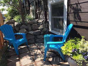 Sunny patio with built in seat.  Great for enjoying a glass of wine