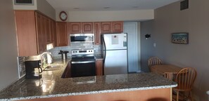 2020 renovated kitchen with granite countertops, backsplash & new flooring!