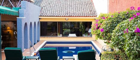 Pool from garden looking towards living room window