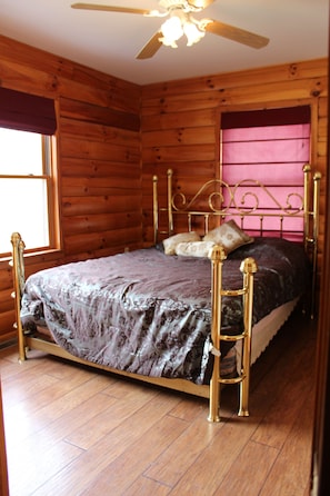 The main bedroom has a half bath and views of the lake.