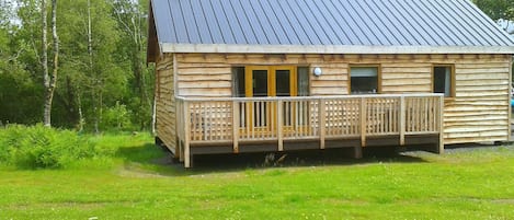 Rear of cabin viewed from meadows