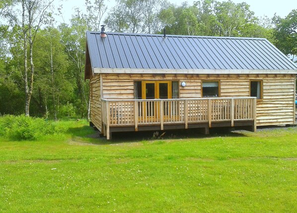 Rear of cabin viewed from meadows