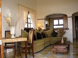 Comfortable lounge with marble floors and high ceilings