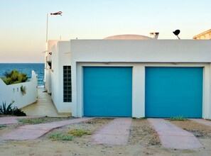 View of the house from the street. Entry walkway on the east side of the house.