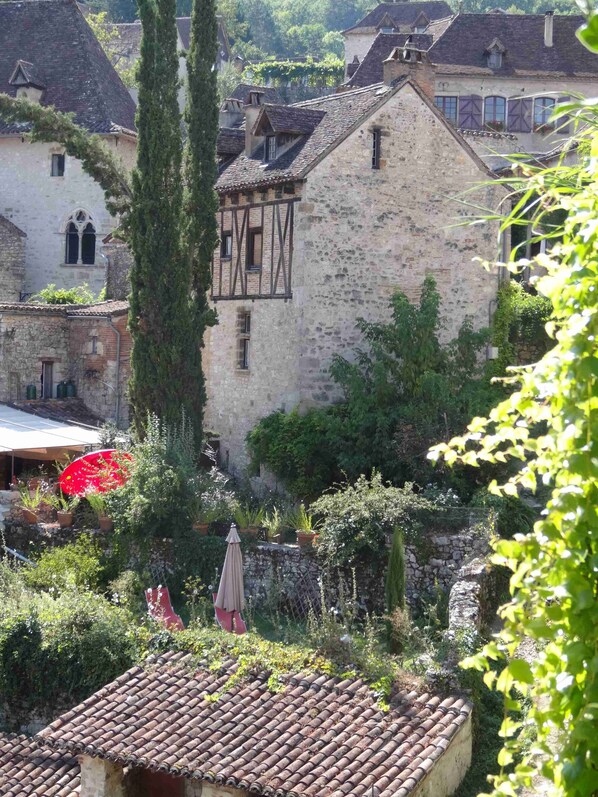 Main View of the House with the Cyprus tree in the garden.