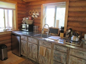Well-appointed kitchen includes refrig, stove, microwave and Keurig coffee maker