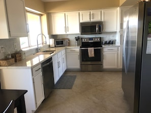 Tiled kitchen with eating area