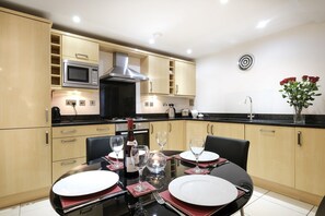 Sleek modern kitchen, ideal for dining at home.