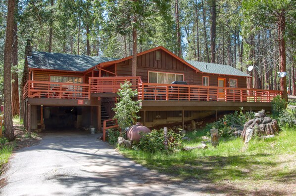 Front of the cabin with a carport