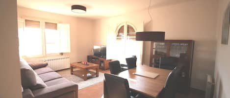 Living room with view on market square and mountains