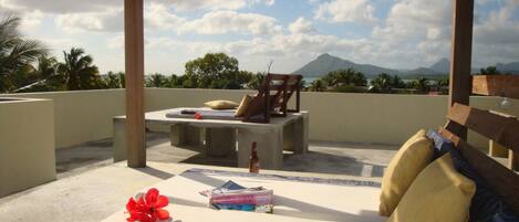 Sunset and star gazing Snuggle on our shared access roof terrace with ocean view