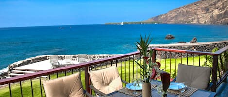 Breathtaking View from Lanai of Kealakekua Bay featuring covered outdoor dining.