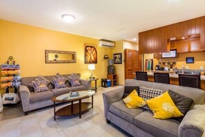 The long common area has two comfortable couches, a flat screen TV, lots of movies and games, and a fully equipped kitchen