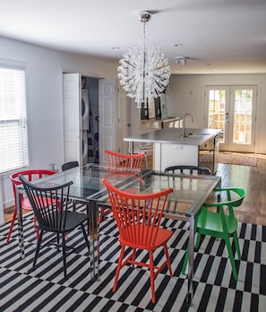 Dining room with open floor plan in the heart of the living space, seats 16