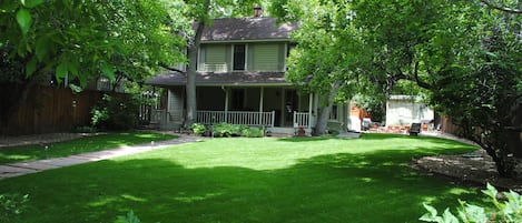 Great front lawn with large trees