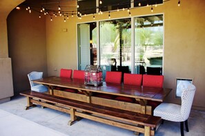 12 foot table on one of two patios, seats 16