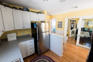 Kitchen with hardwood floors and stainless steel appliances