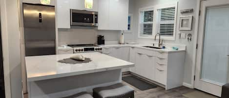 Kitchen with built in island with seating for 4