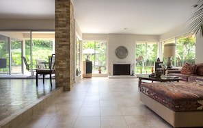 Living room and dining room with garden view