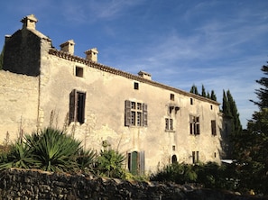 Even under the August sun, the stone walls keep it cool indoors.