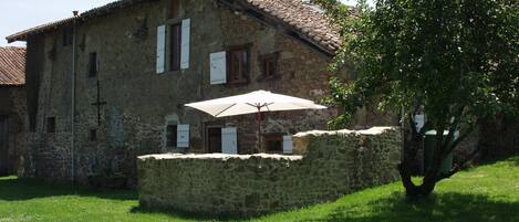 Rear of Gite showing garden, sitting area and BBQ