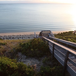 Private stairs from the deck lead to your own sandy beach.