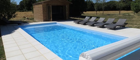 Heated Swimming pool (9M x 4M) with tanning step and full width tanning step.