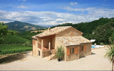 Spectacular views across the pool to mountains and historic village. 