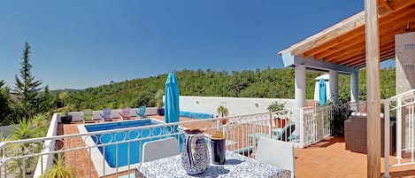 South facing gated terrace over pool, partially in full sun, partially shaded