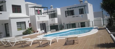 pool area, apartment at end, directly overlooking pool.