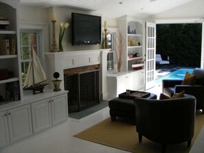 Seating area with fireplace and TV