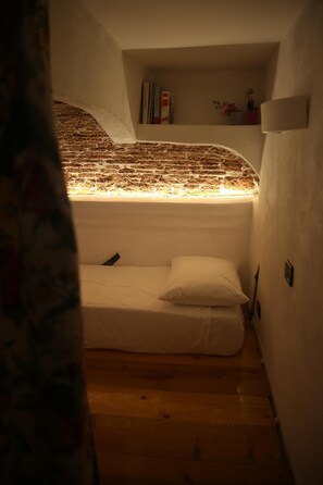 The bed on the mezzanine in the room