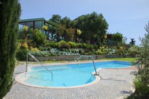 Main building is connected to the glass house (w jacuzzy) by a glass hallway. 