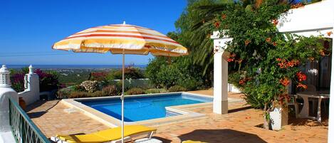 Pool deck and panoramic sea views of coastline and offshore islands