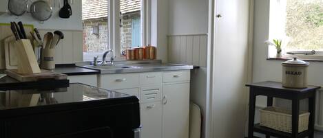 Kitchen with all the utensils and crockery you'll need for family cooking.