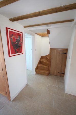 Hallway with door to bathroom and stairs/lightwell