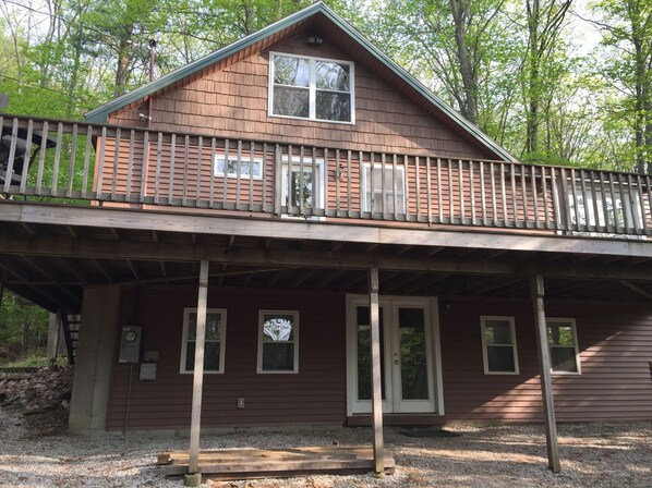 House settled back in Private Drive and Partial Lake Views, Beach near driveway