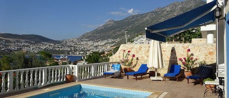 Private pool with sun shades and view into Kalkan Town