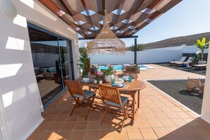 Nice terrace with outdoor furniture, private heated pool and beautiful views.