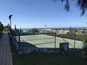 Free floodlit tennis court. 